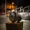 Stainless steel and treated oak; 79cm high x 70cm long x 40cm wide, 2018. Denny, Falkirk, Scotland for Falkirk Council. Photo: Scotdrone